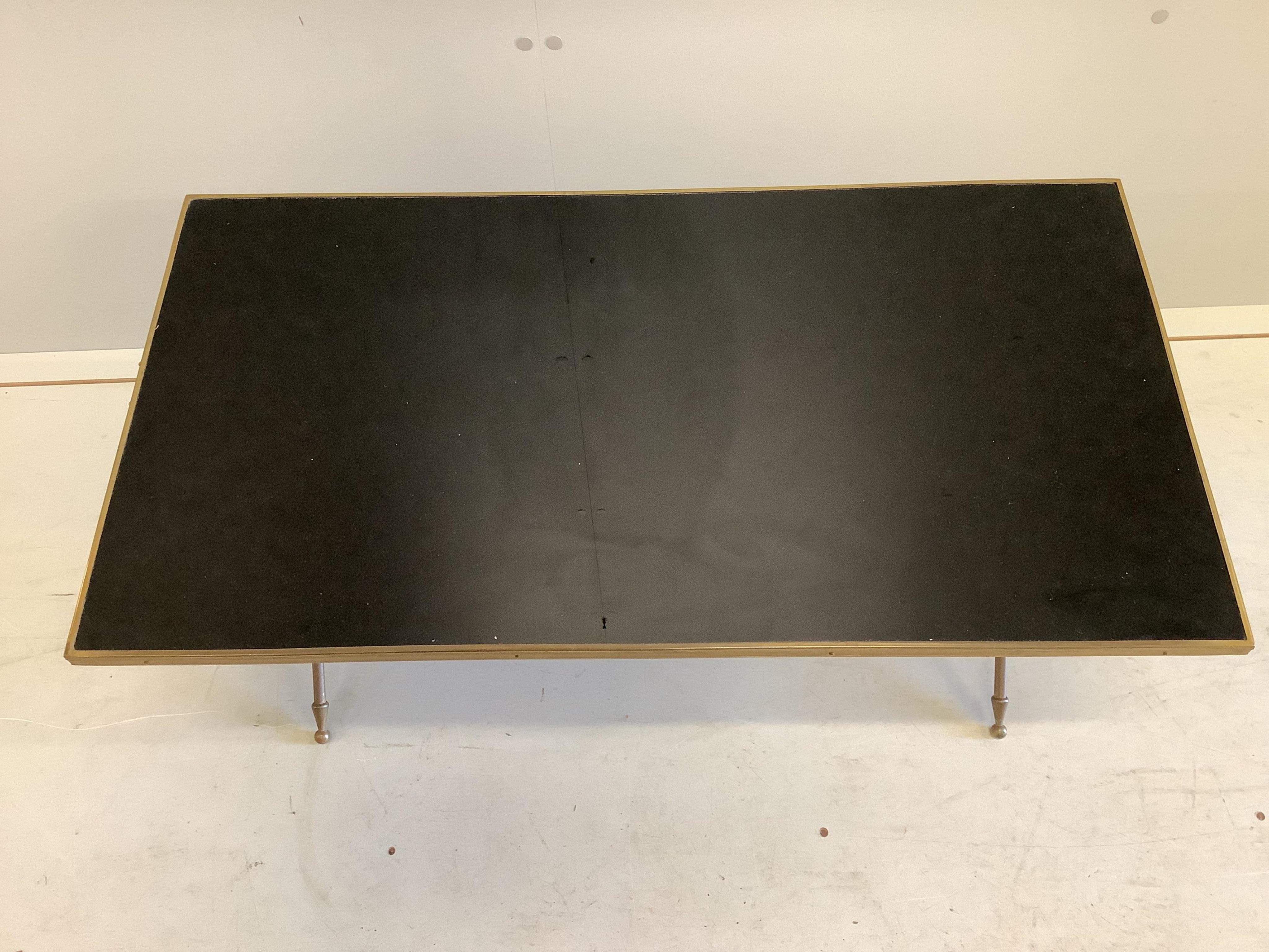 A Maison Jansen style brass and black laminate coffee table, width 85cm, depth 45cm, height 40cm. Condition - fair